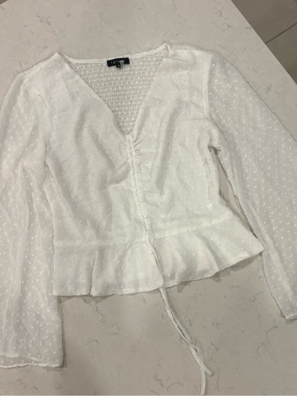 1. State White Swiss Dot V-Neck Tie-Front Peplum Blouse